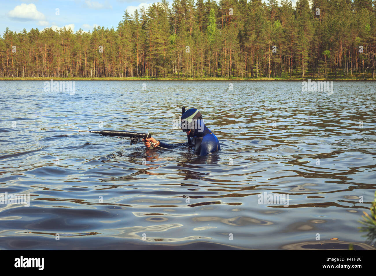 Underwater hunter preparing to dive. Fishing on a forest lake Stock Photo Alamy