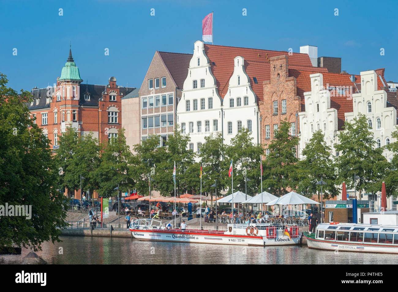 Historic houses, excursion boats on the river Trave, Lübeck, Schleswig-Holstein, Germany Stock Photo