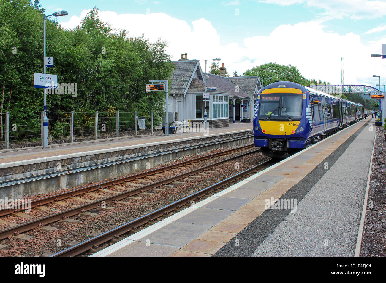 Class 170 DMU awaits at Carrbridge Railway Station while travelling down the Highland Mainline towards the Central Belt of Scotland Stock Photo