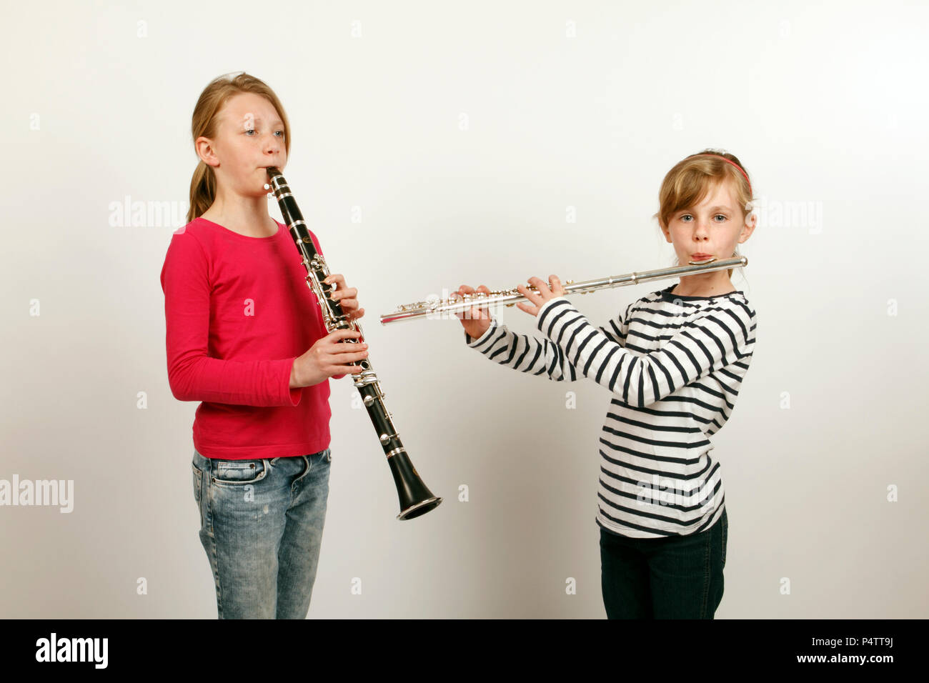 Two girls playing a duet on and Flute Stock Photo Alamy