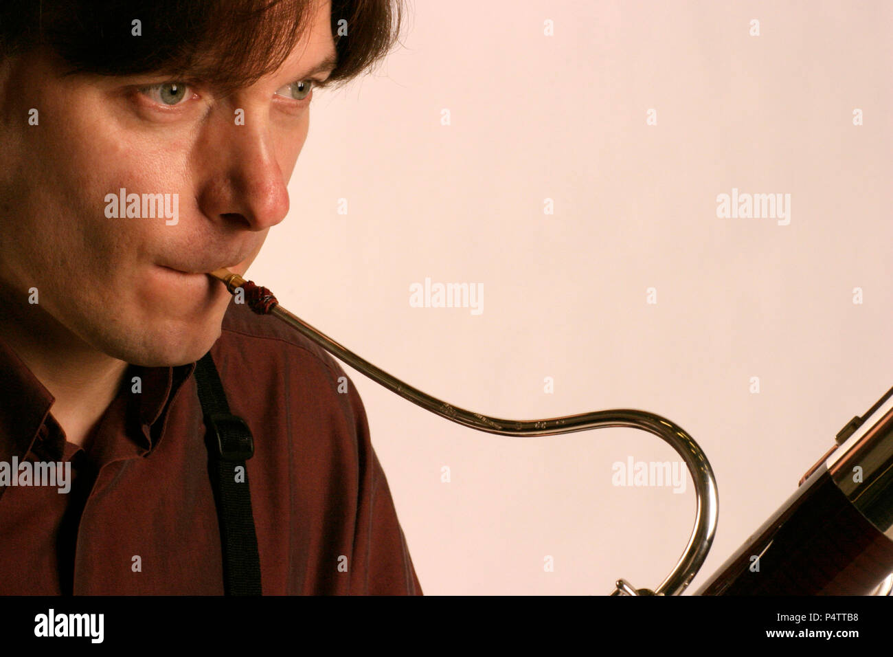 Bassoon crook and reed, and closeup of embouchure. Player Jaroslaw