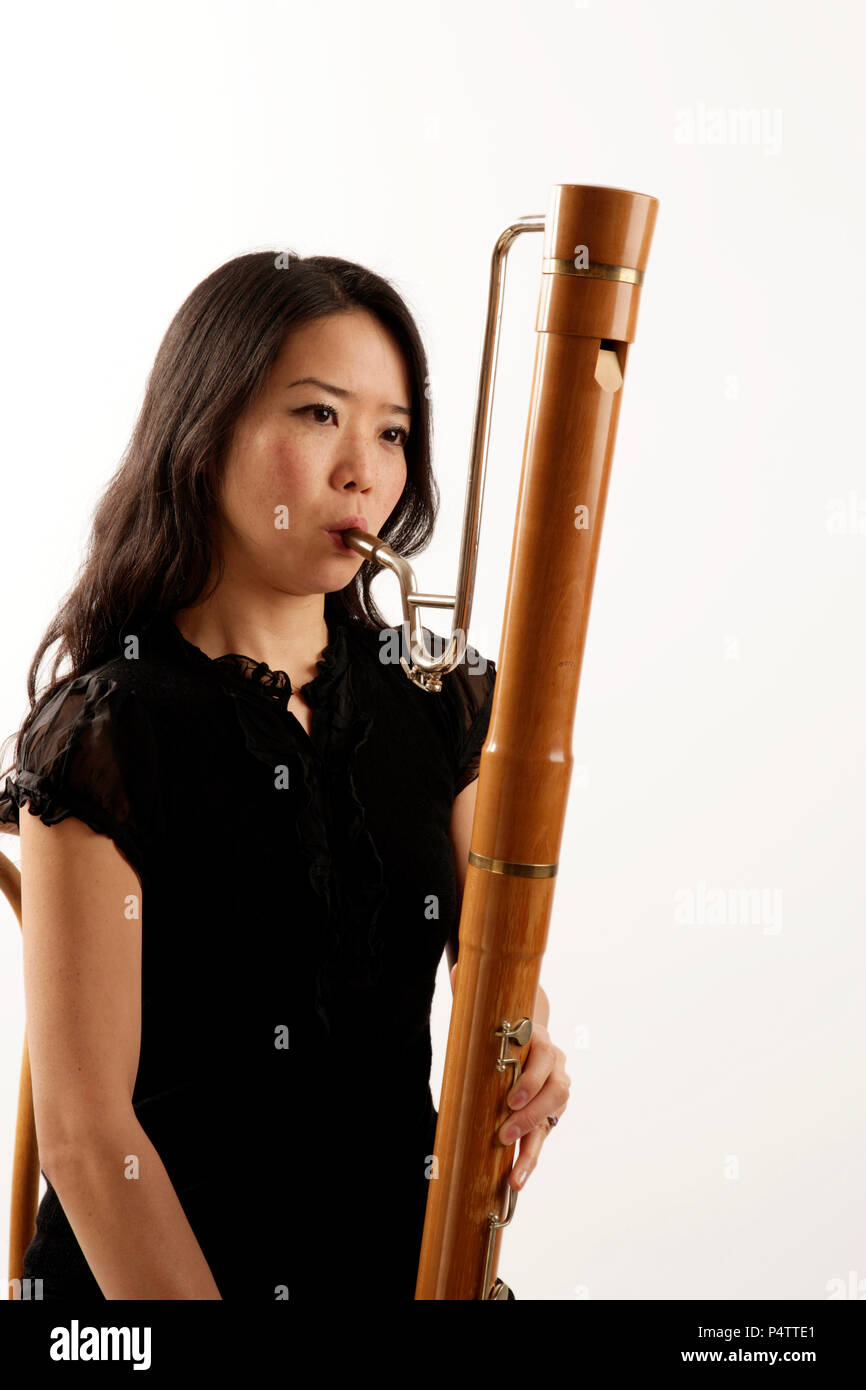 Young woman playing the bass recorder Stock Photo Alamy
