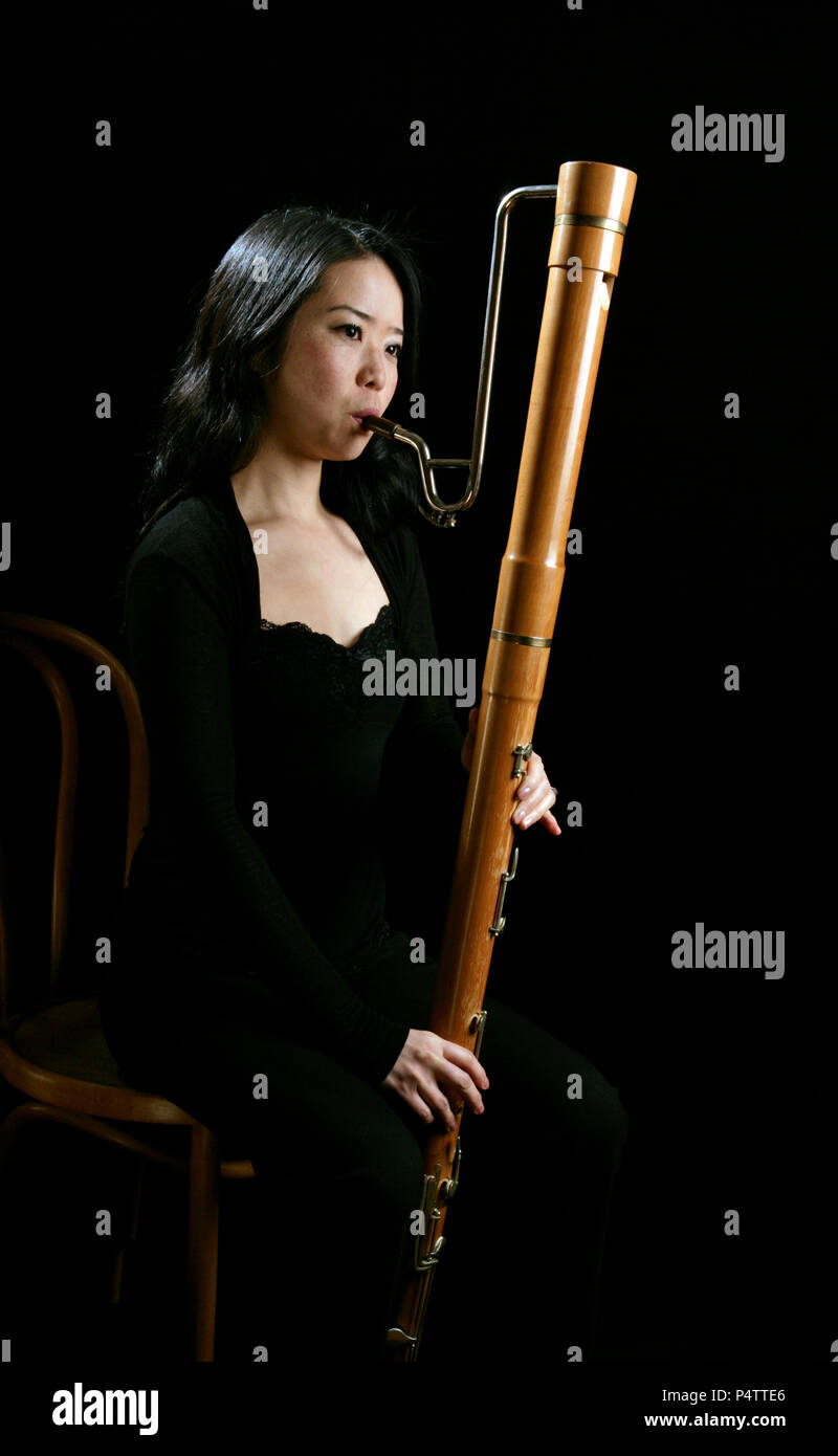 Young woman playing the bass recorder Stock Photo Alamy