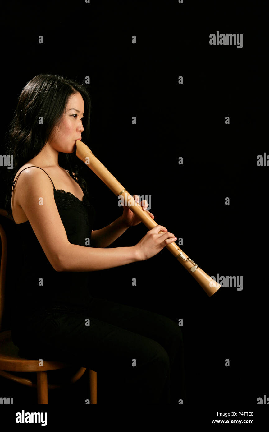 Young woman playing recorder hires stock photography and images Alamy