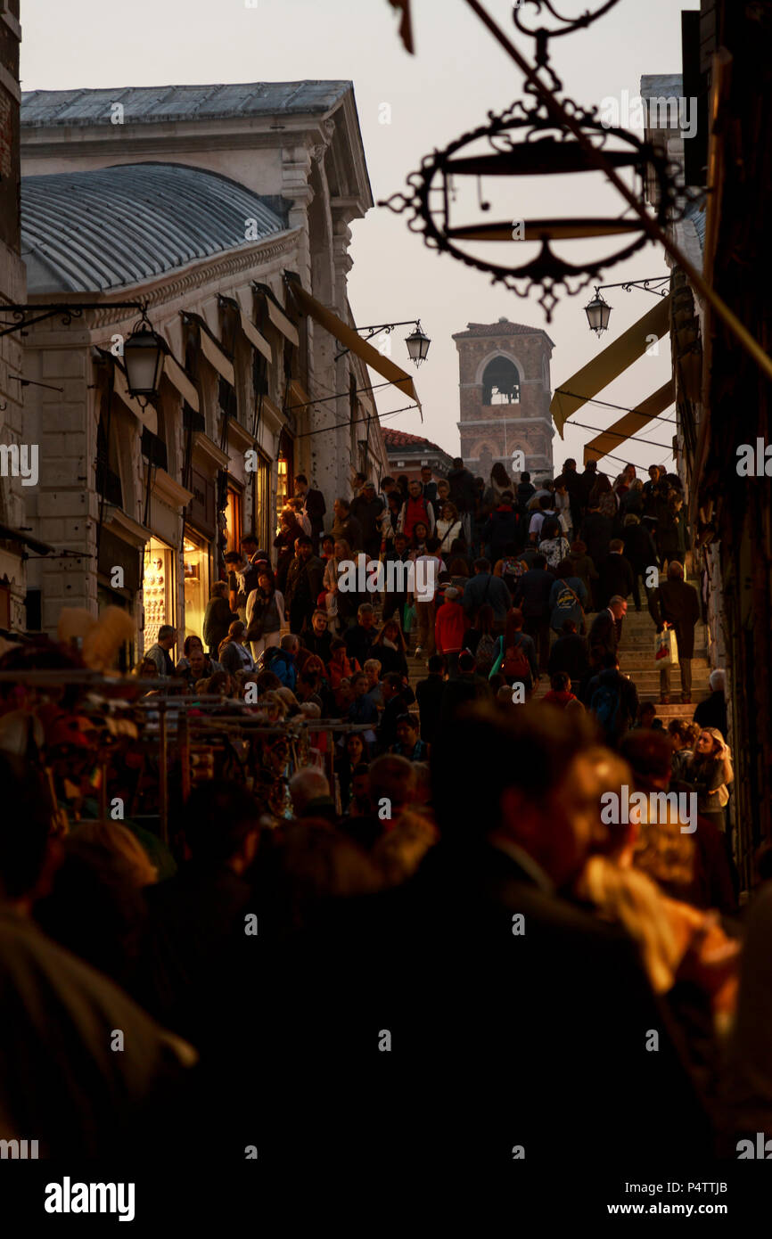 Evening crowds fill the Rialto Bridge at night, Venice Italy. Stock Photo