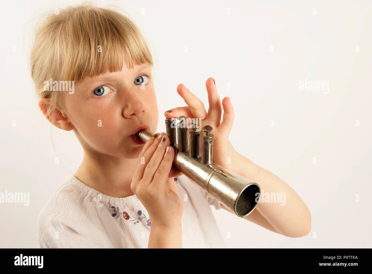 Girl playing trumpet into microphone - Stock Image - F005/1164 - Science  Photo Library