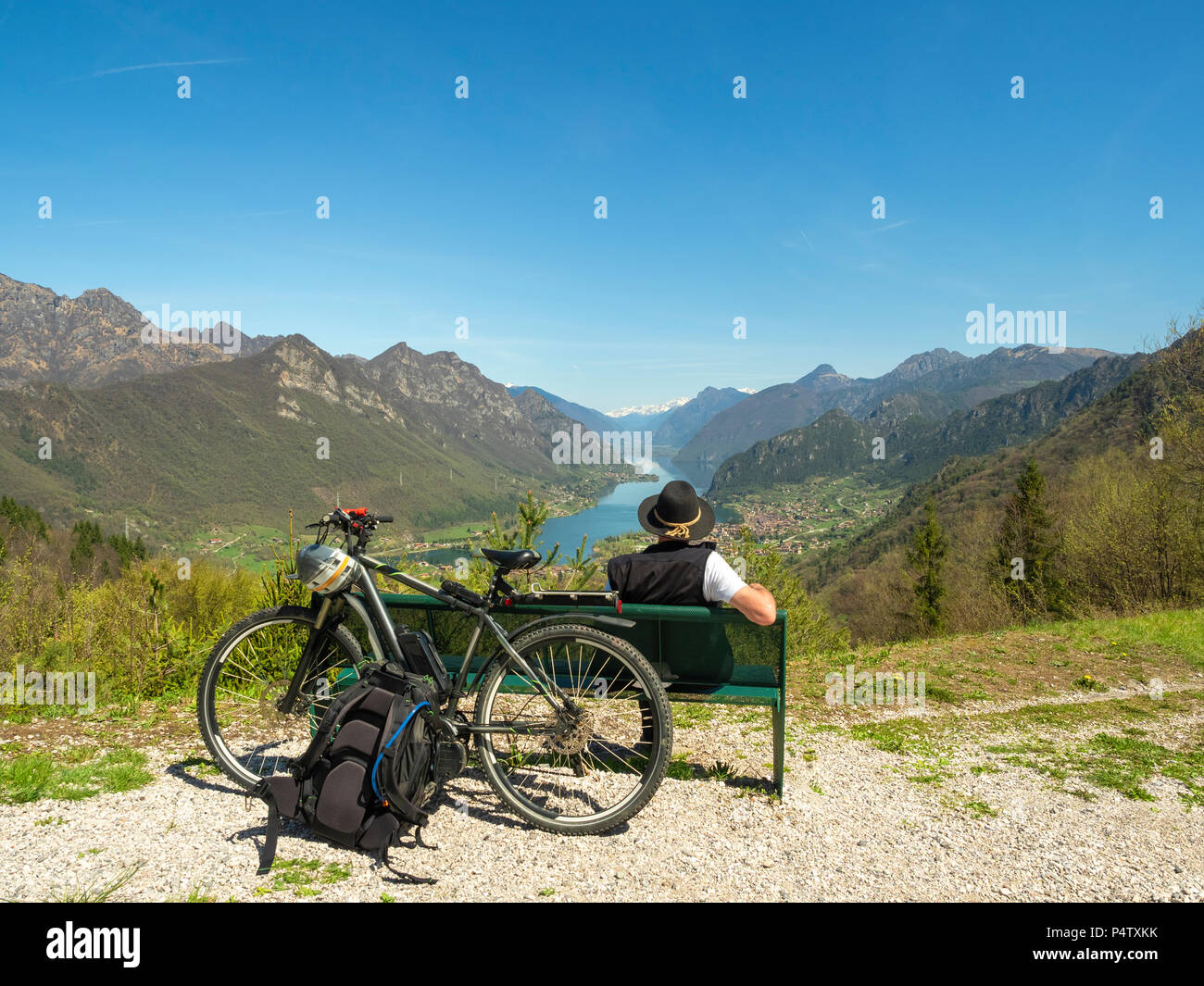 Italy, Lombardy, Senior hiker looking over Idro lake, Adamello Alps, Parco Naturale Adamello Brenta Stock Photo