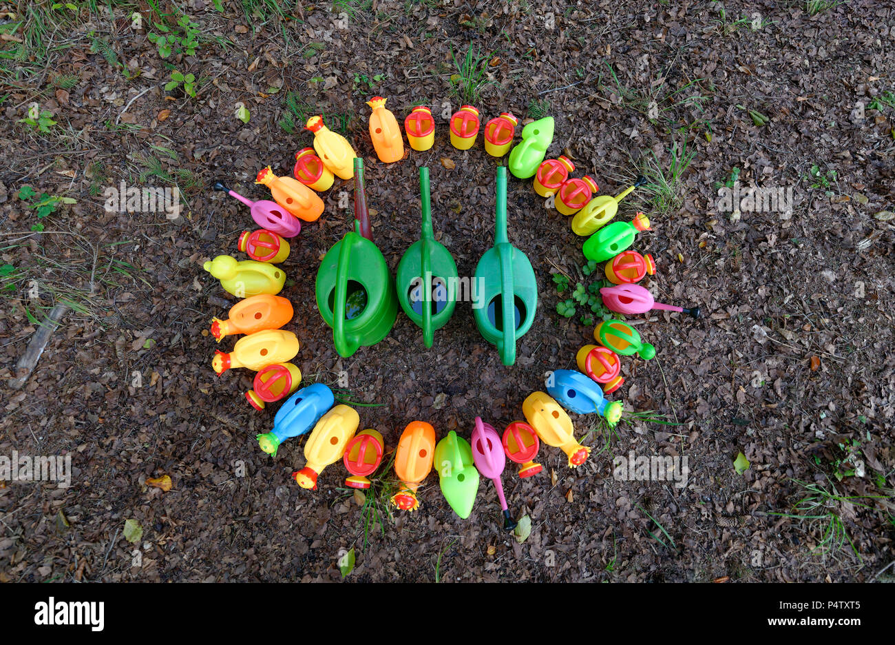 Colorful watering cans Stock Photo