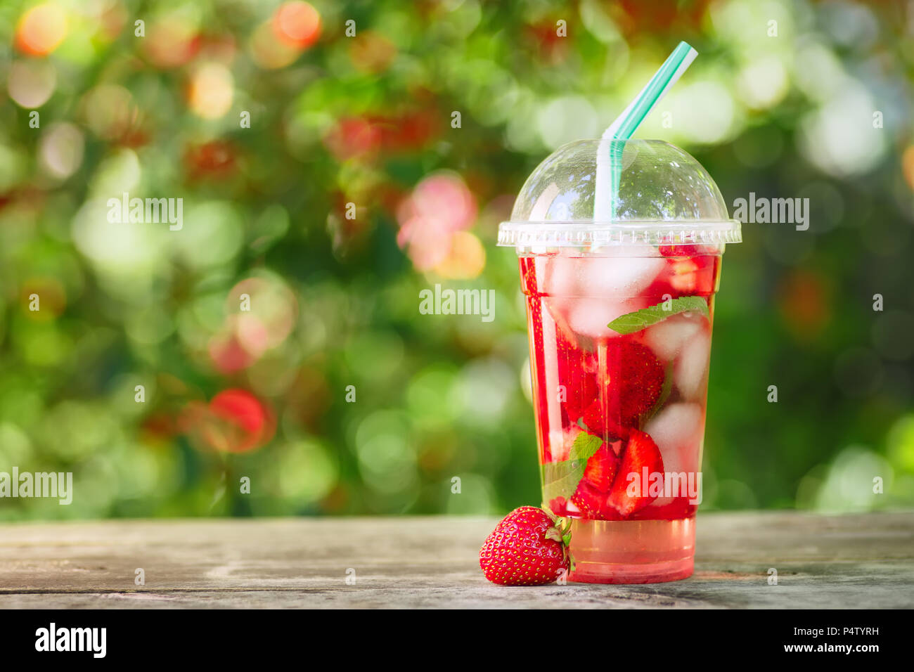 strawberry lemonade in plastic glass Stock Photo