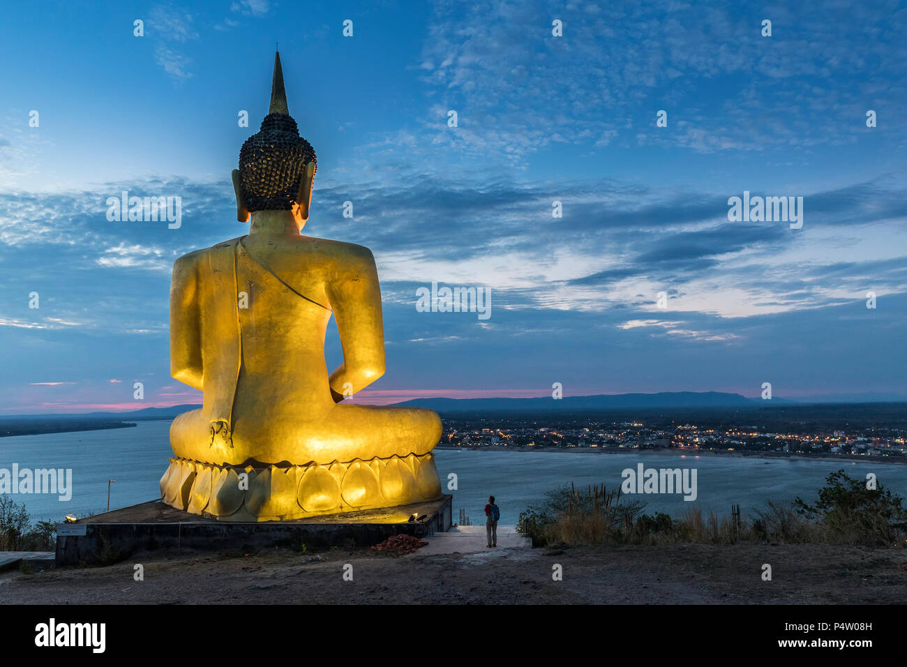 Person looking at the Golden Buddha at Wat Pho Salao at sunset, Pakse, Laos  Stock Photo - Alamy