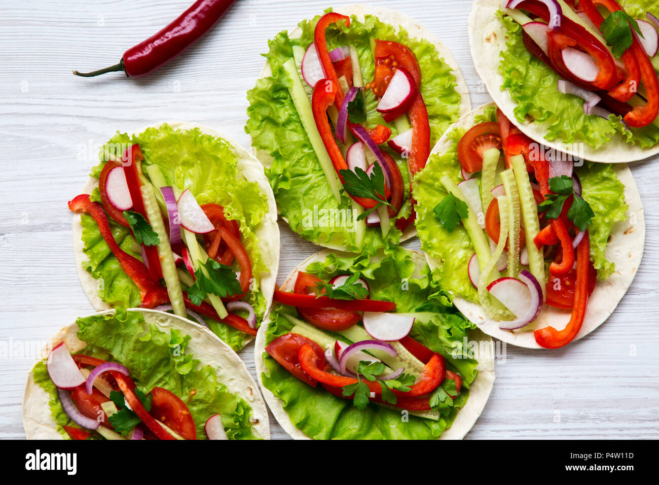 Corn Tortillas With Lettuce Redish Cucumber Onion Parsley And