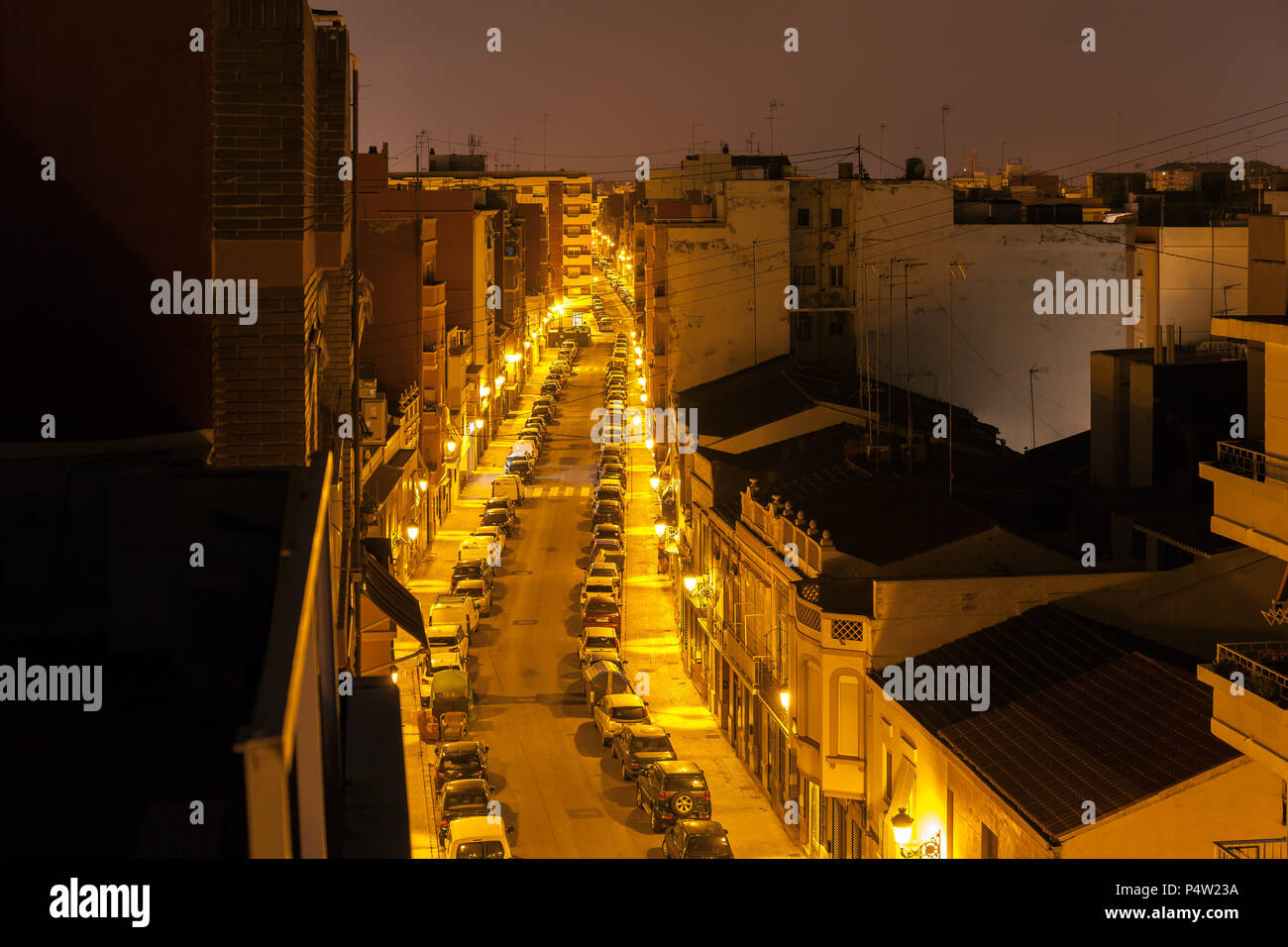 Valencia, Spain, Illuminated street in a residential area in Valencia at night Stock Photo