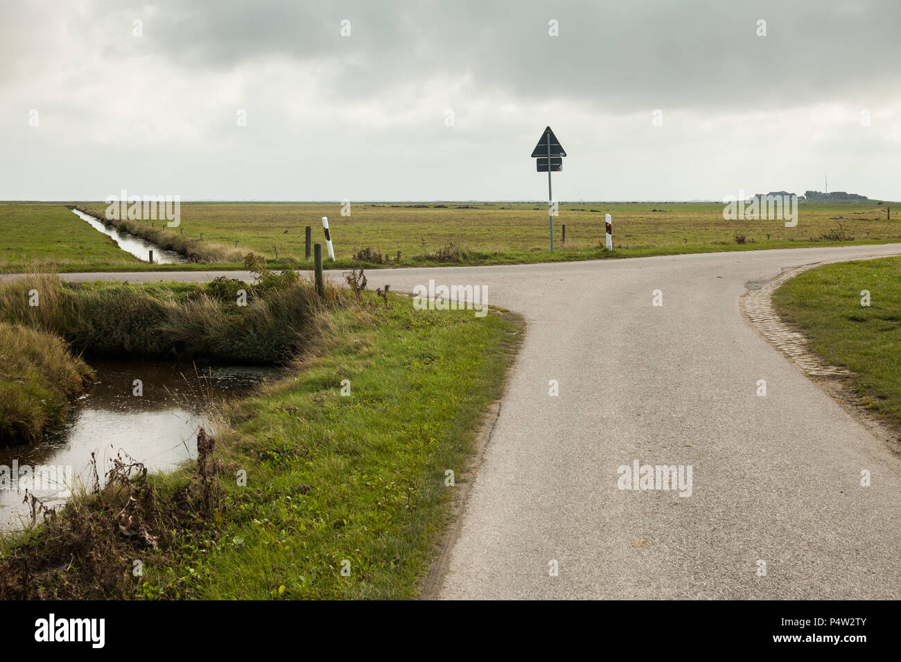 Hallig Hooge, Germany, drainage ditches and road junction on Hallig Hooge Stock Photo