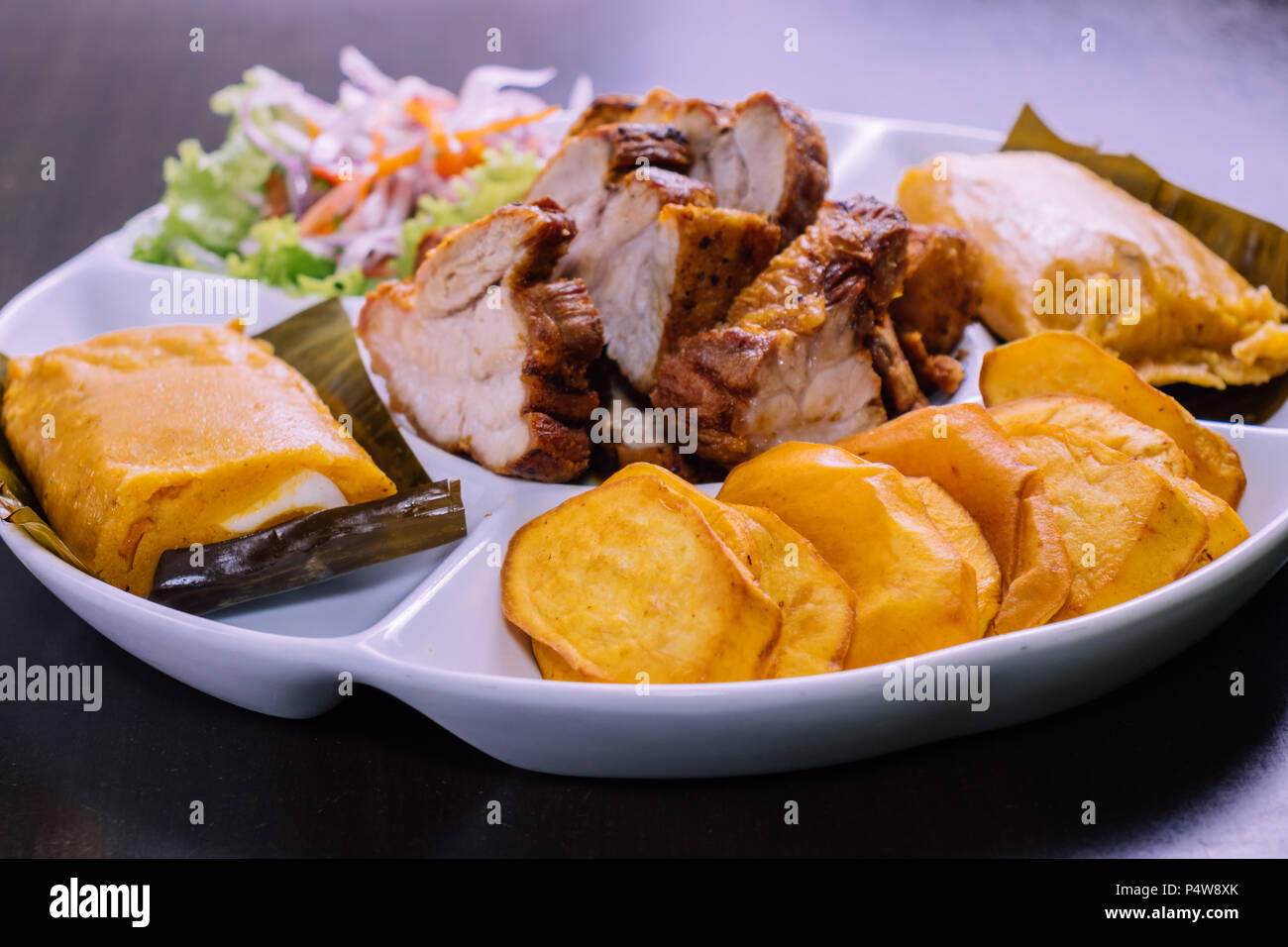 peruvian food breakfast tamales con chicharron desayuno peruano Stock