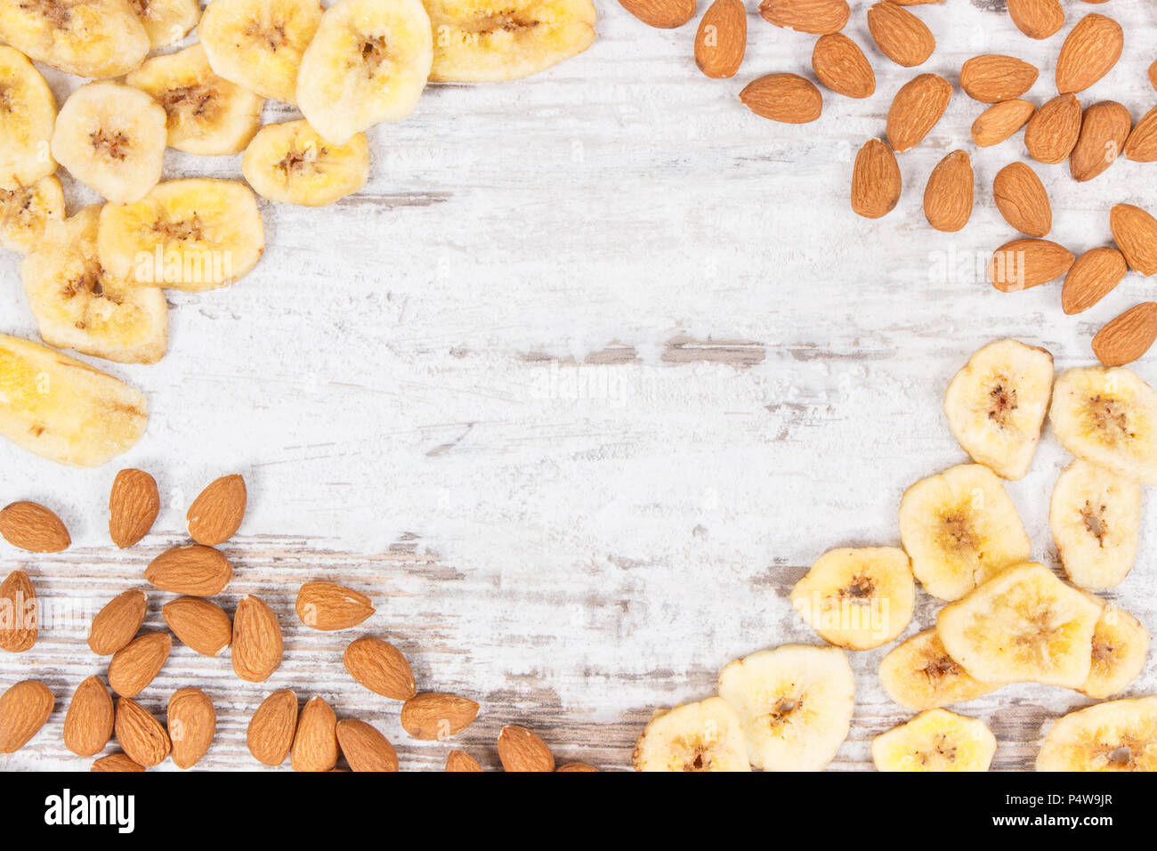 Frame of almonds and banana chips as source carbohydrates, dietary