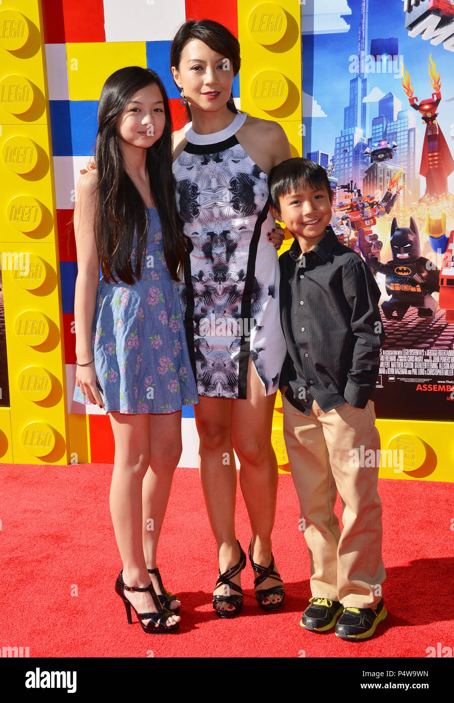 Ming-Na and children Michaela Zee and Cooper Dominic Zee 118 arriving at The Lego Movie Premiere at the Westwood Village Theatre in Los Angeles.Ming-Na and children Michaela Zee and Cooper Dominic Zee 118 ------------- Red Carpet Event, Vertical, USA, Film Industry, Celebrities,  Photography, Bestof, Arts Culture and Entertainment, Topix Celebrities fashion /  Vertical, Best of, Event in Hollywood Life - California,  Red Carpet and backstage, USA, Film Industry, Celebrities,  movie celebrities, TV celebrities, Music celebrities, Photography, Bestof, Arts Culture and Entertainment,  Topix, vert Stock Photo
