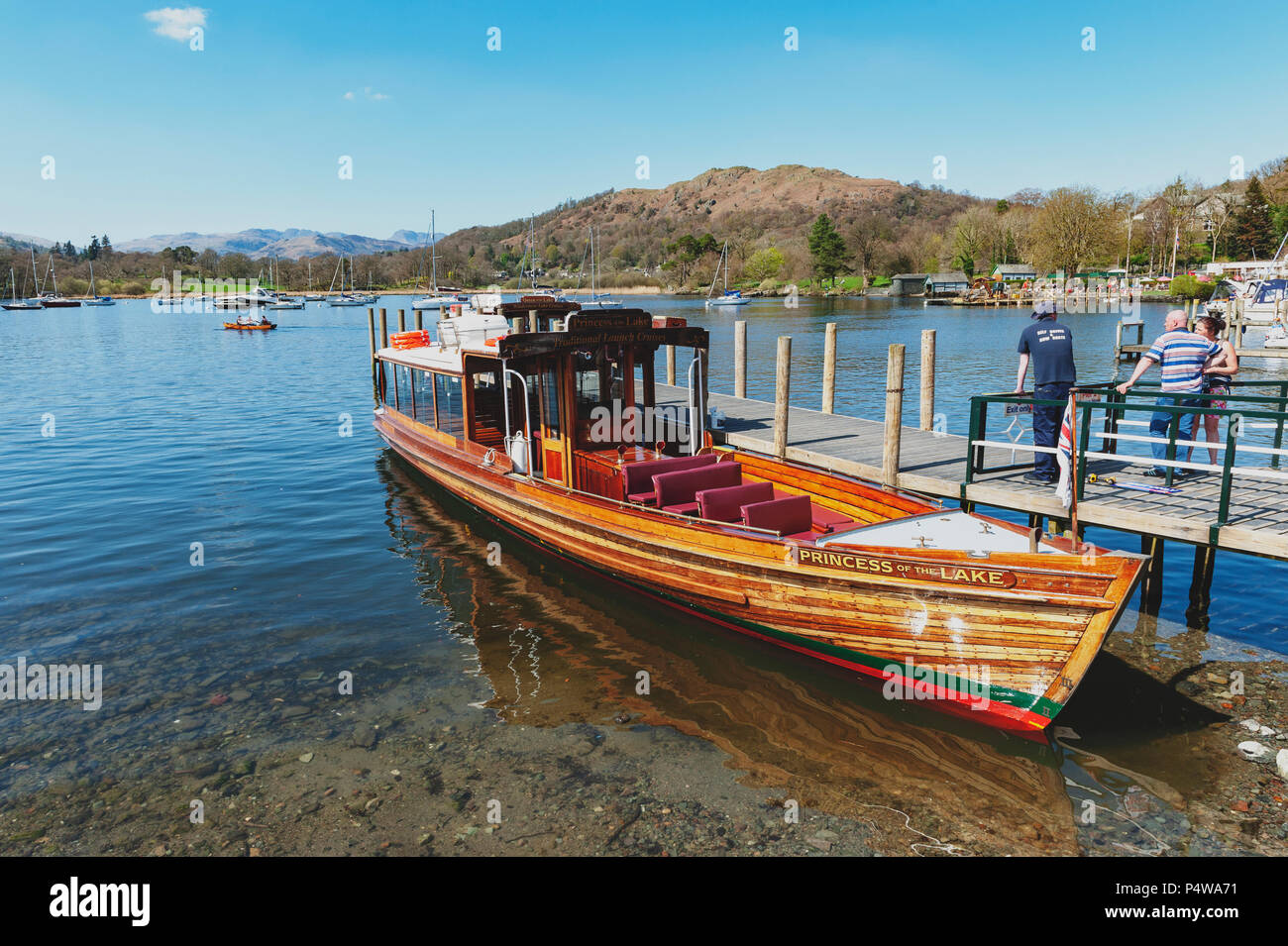 Tourist boat cruise at Waterhead Pier in Ambleside, a lakeside town