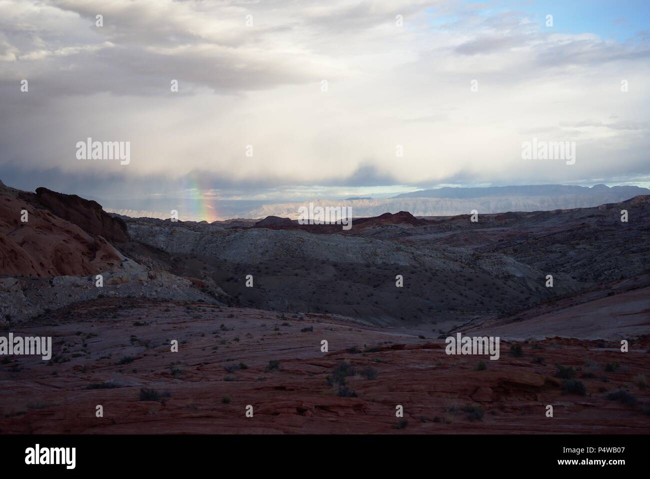 A rainbow over valley of fire state park Stock Photo