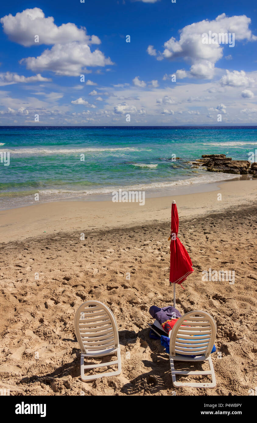 Summertime. Realx on beach: a place in the sun. The most beautiful sandy shoreline of Apulia:  Salento coast, Frassanito Beach (ITALY). From Torre Del Stock Photo