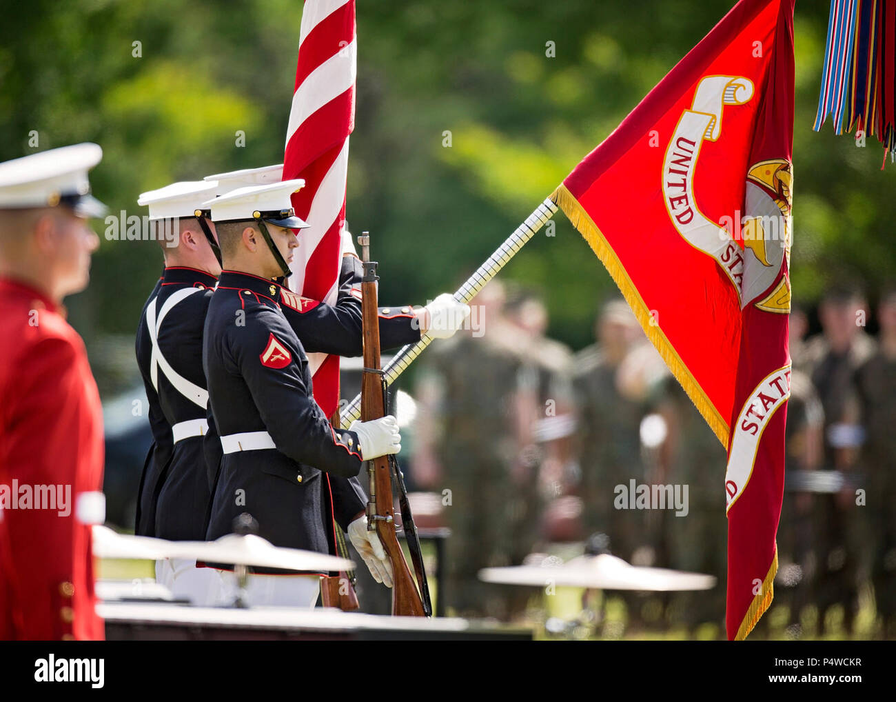 The U.S. Marine Corps Quantico Color Guard presents the colors during the Centennial Celebration Ceremony at Lejeune Field, Marine Corps Base (MCB) Quantico, Va., May 10, 2017. The event commemorates the founding of MCB Quantico in 1917, and consisted of performances by the U.S. Marine Corps Silent Drill Platoon and the U.S. Marine Drum & Bugle Corps. Stock Photo