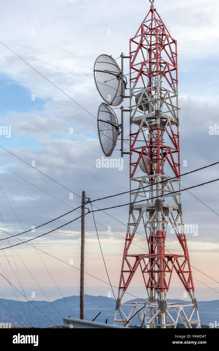 Transmission lines passing through broadcast tower. Satellite disk