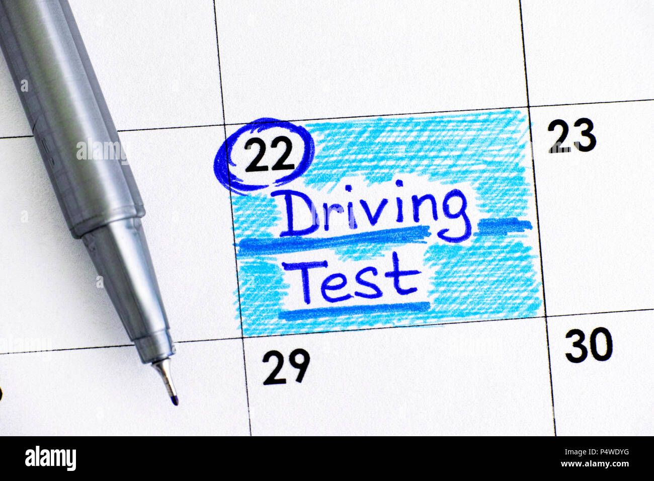 Reminder Driving Test in calendar with pen. Close-up. Stock Photo