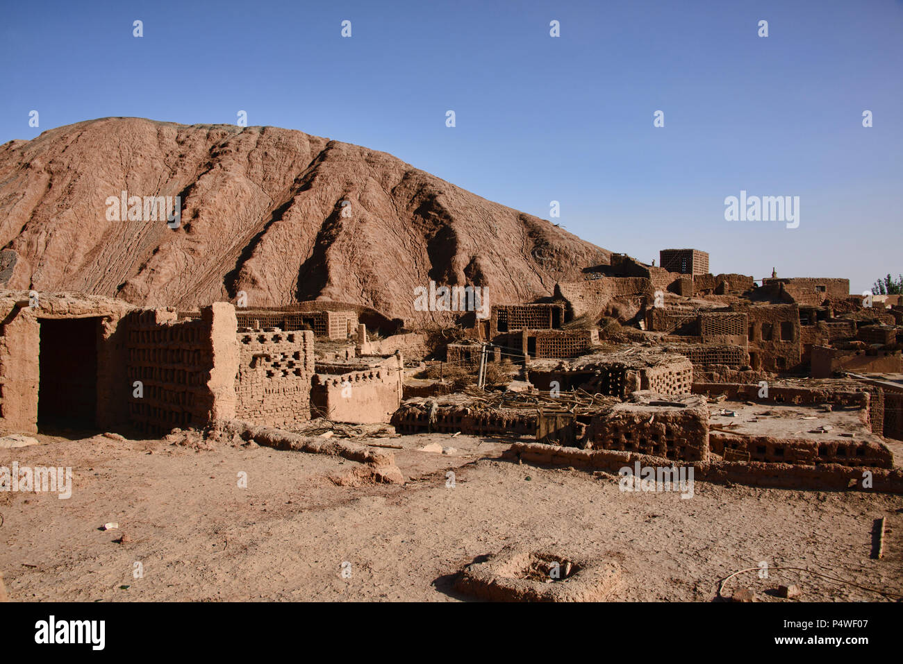 Ancient mud brick village in the Tuyoq Valley, Turpan, Xinjiang, China Stock Photo