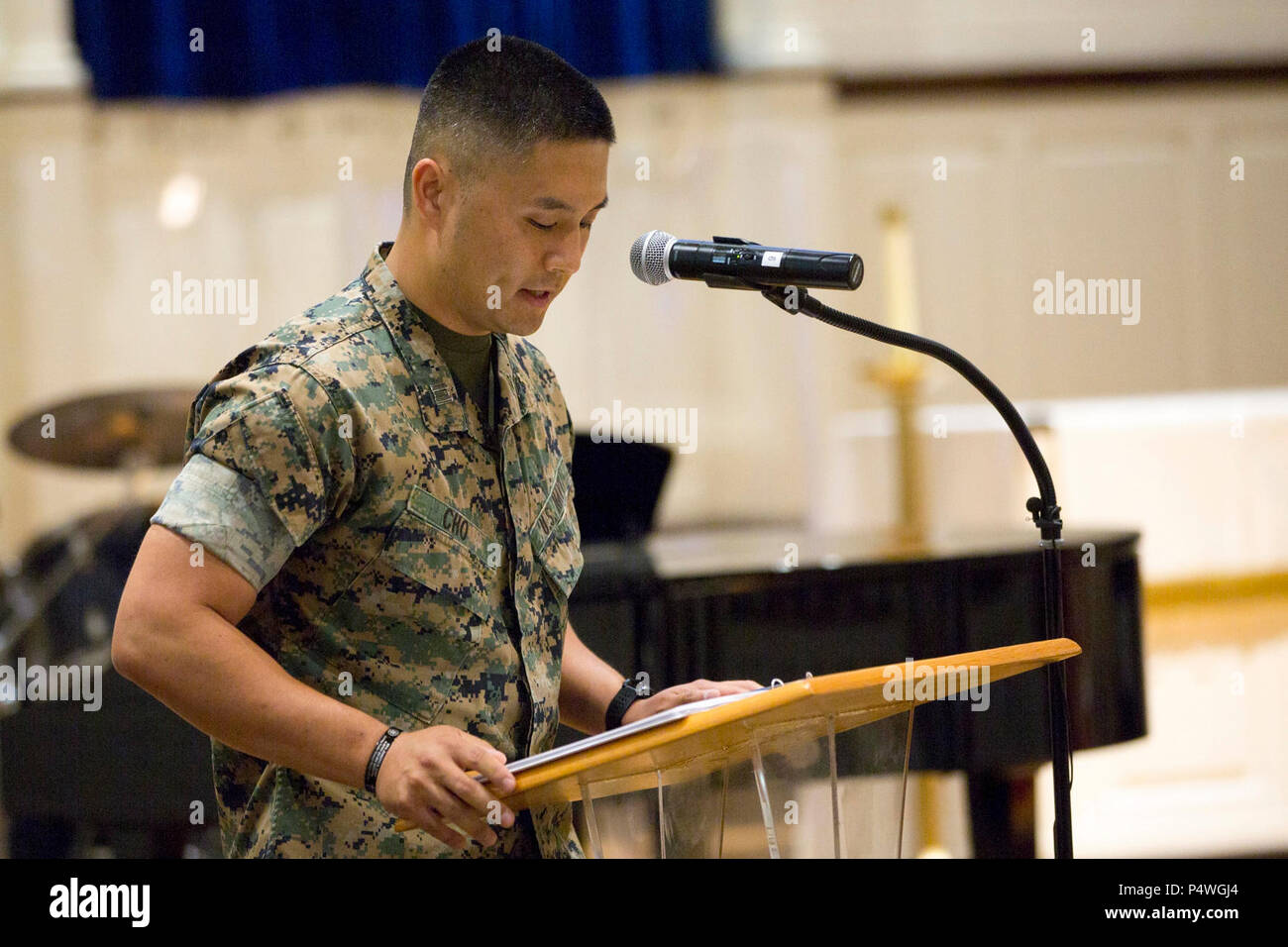 U.S. Navy LT Danny K. Cho, chaplain with 2d Combat Engineer Battalion, gives the invocation during 1st Lt. Garrett C. Cheung's memorial service on Camp Lejeune, N.C., May 9, 2017. 1st Lt. Cheung is survived by his parents, ALexander and Florence Cheung and his sister, Brigette. Stock Photo