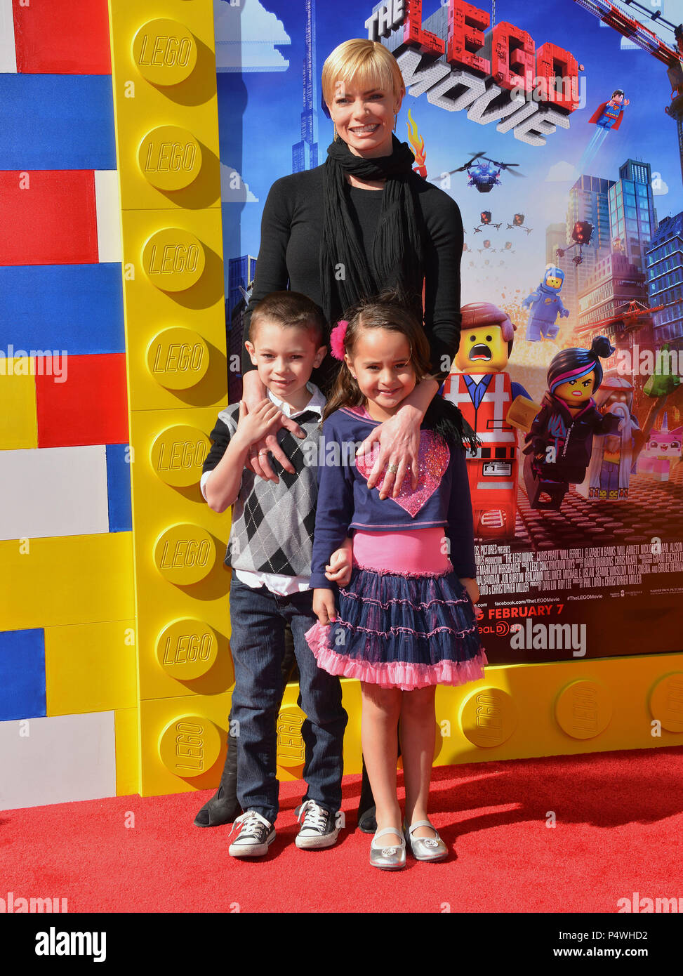 Dezi James Calvo; Jaime Pressly 136- arriving at The Lego Movie Premiere at the Westwood Village Theatre in Los Angeles.Dezi James Calvo; Jaime Pressly 136- ------------- Red Carpet Event, Vertical, USA, Film Industry, Celebrities,  Photography, Bestof, Arts Culture and Entertainment, Topix Celebrities fashion /  Vertical, Best of, Event in Hollywood Life - California,  Red Carpet and backstage, USA, Film Industry, Celebrities,  movie celebrities, TV celebrities, Music celebrities, Photography, Bestof, Arts Culture and Entertainment,  Topix, vertical,  family from from the year , 2014, inquiry Stock Photo