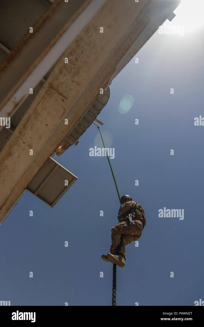 An Italian Soldier fast ropes down a tower at the Royal Jordanian Naval ...