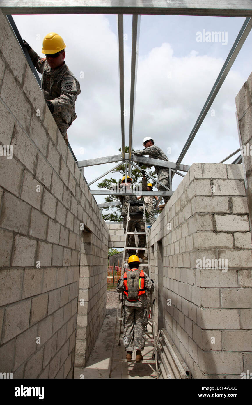 U.S. Soldiers, with the 485th Engineer Company, bolt down the support