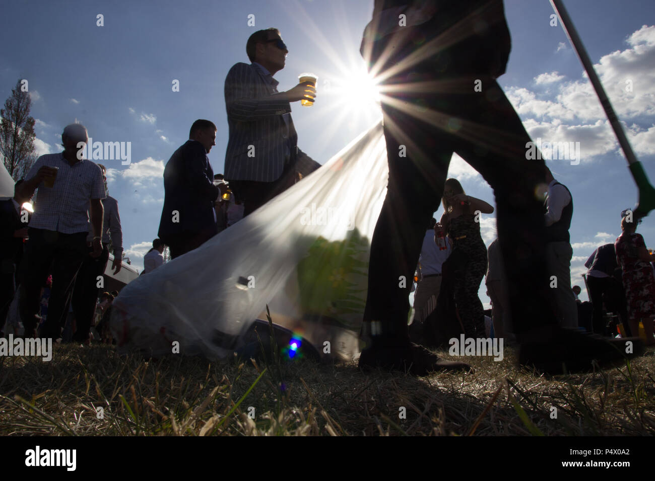 Silhouette of rubbish being collected at Royal Ascot Stock Photo Alamy