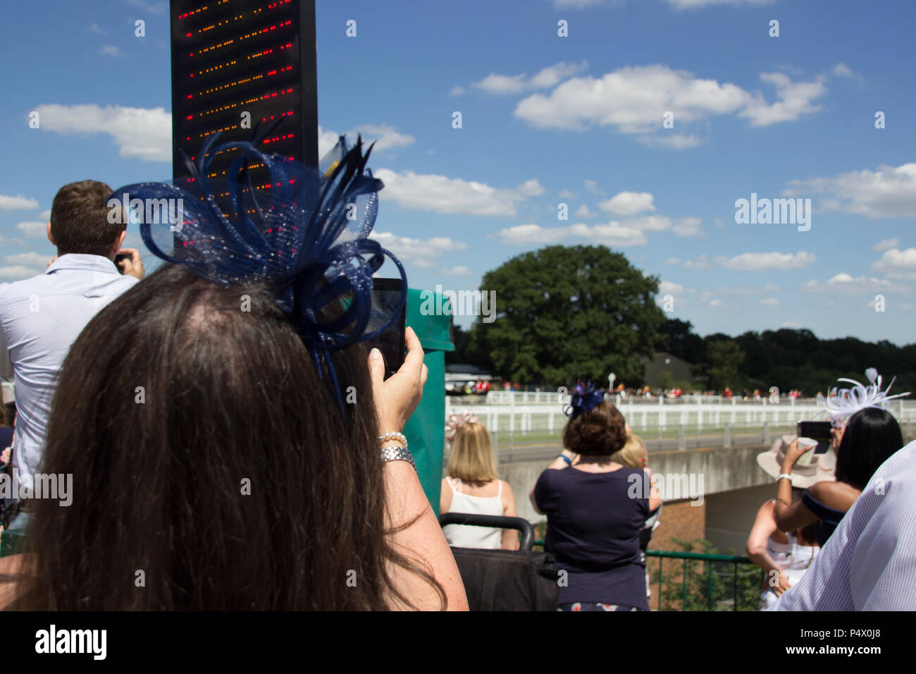 Crowds standing watching the races as Royal Ascot in Windsor enclosure