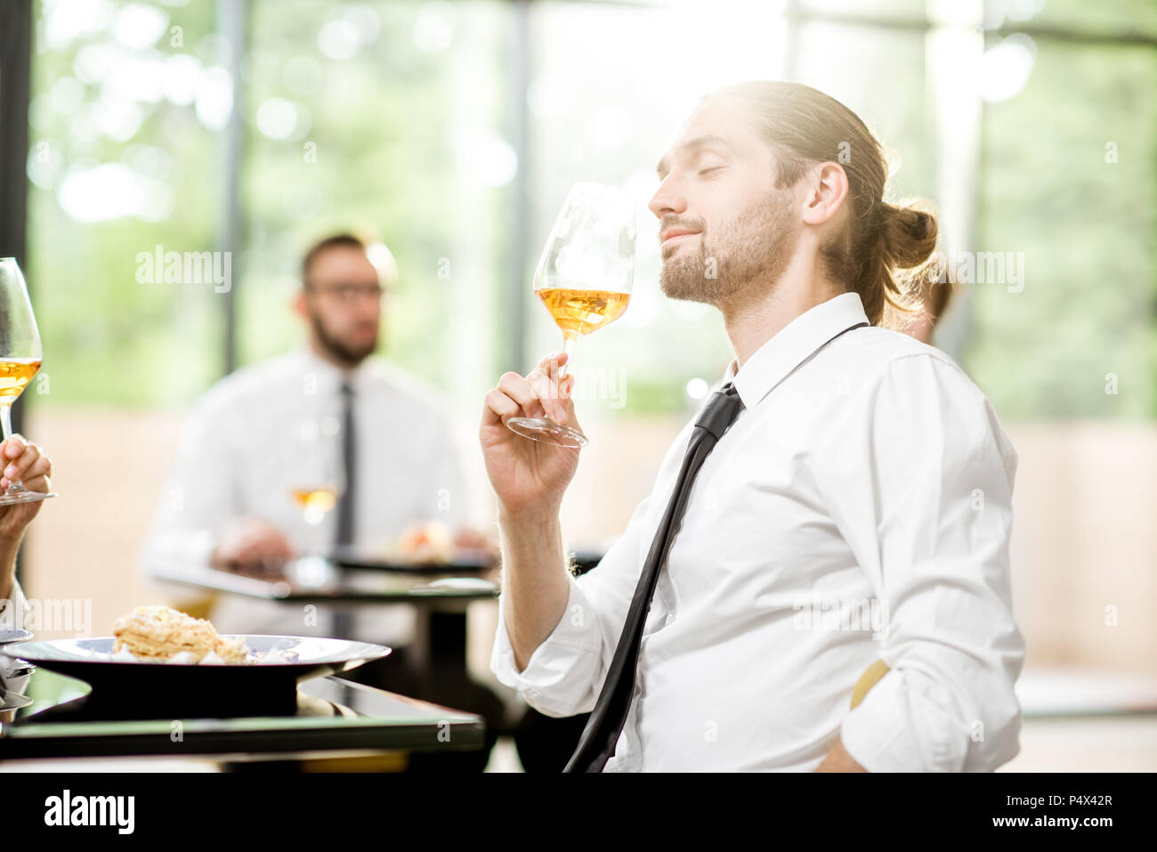 Business people during a lunch at the restaurant Stock Photo