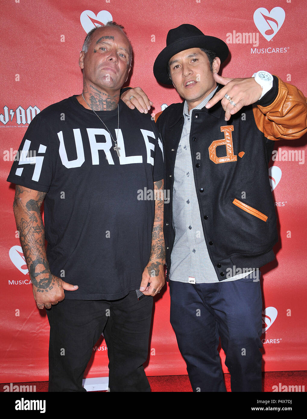 Jay Adams and Christian Hosoi arriving at Musicares Benefit at the Club Nokia in Los Angeles.Jay Adams and Christian Hosoi  Event in Hollywood Life - California, Red Carpet Event, USA, Film Industry, Celebrities, Photography, Bestof, Arts Culture and Entertainment, Topix Celebrities fashion, Best of, Hollywood Life, Event in Hollywood Life - California, Red Carpet and backstage, movie celebrities, TV celebrities, Music celebrities, Topix, actors from the same movie, cast and co star together.  inquiry tsuni@Gamma-USA.com, Credit Tsuni / USA, 2013 - Group, TV and movie cast Stock Photo
