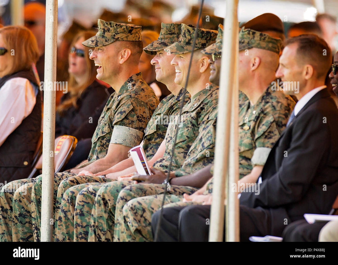 Attendees watch the Centennial Celebration Ceremony at Lejeune Field, Marine Corps Base (MCB) Quantico, Va., May 10, 2017. The event commemorates the founding of MCB Quantico in 1917, and consisted of performances by the U.S. Marine Corps Silent Drill Platoon and the U.S. Marine Drum & Bugle Corps. Stock Photo