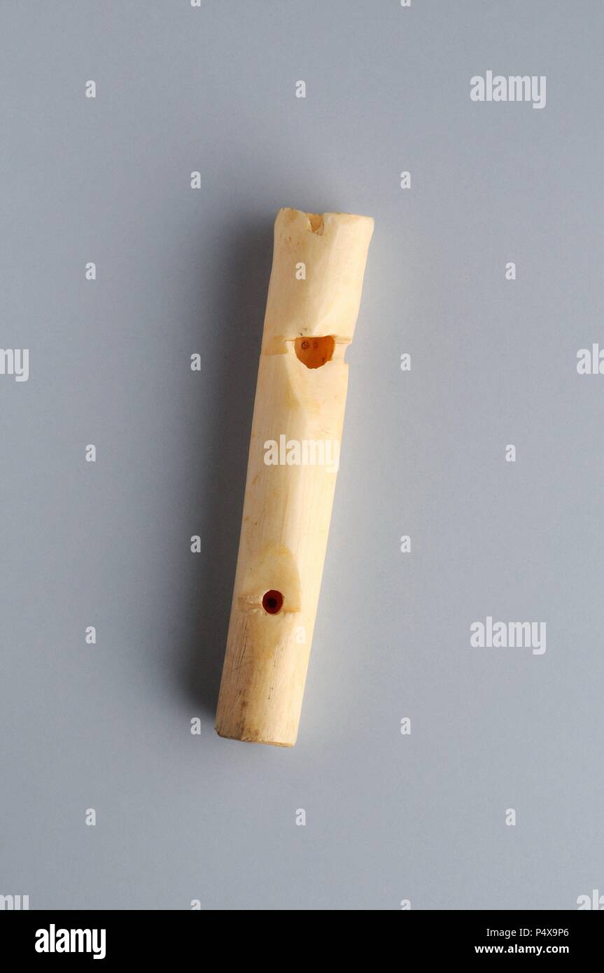 Whistle two holes made in bone. Length 6 1 cm Maximum diameter 1.1 cm (12th- 14 th ) - Medieval period belonging of the ' Burgo de Santiuste Museum' in Alcalá de Henares. (Madrid). SPAIN. Stock Photo