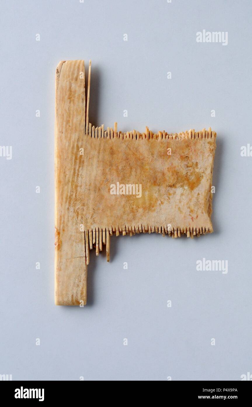 Nit of bone. 5 cms x 3, 5 cm Thickness  0.2 cm (12th- 14 th) - Medieval period  belonging of the ' Burgo de Santiuste Museum' in Alcalá de Henares. (Madrid). SPAIN. Stock Photo