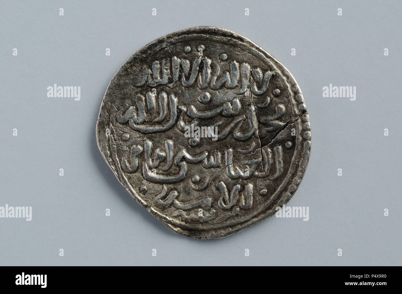 Silver dirham to ' al Watiq '. (Front) Diameter 18 mm Thickness 5mm Weight 1, 4 grams (1238-1269 Ce) - Hispanic-Muslim period belonging of the ' Burgo de Santiuste Museum' in Alcalá de Henares. (Madrid). SPAIN. Stock Photo
