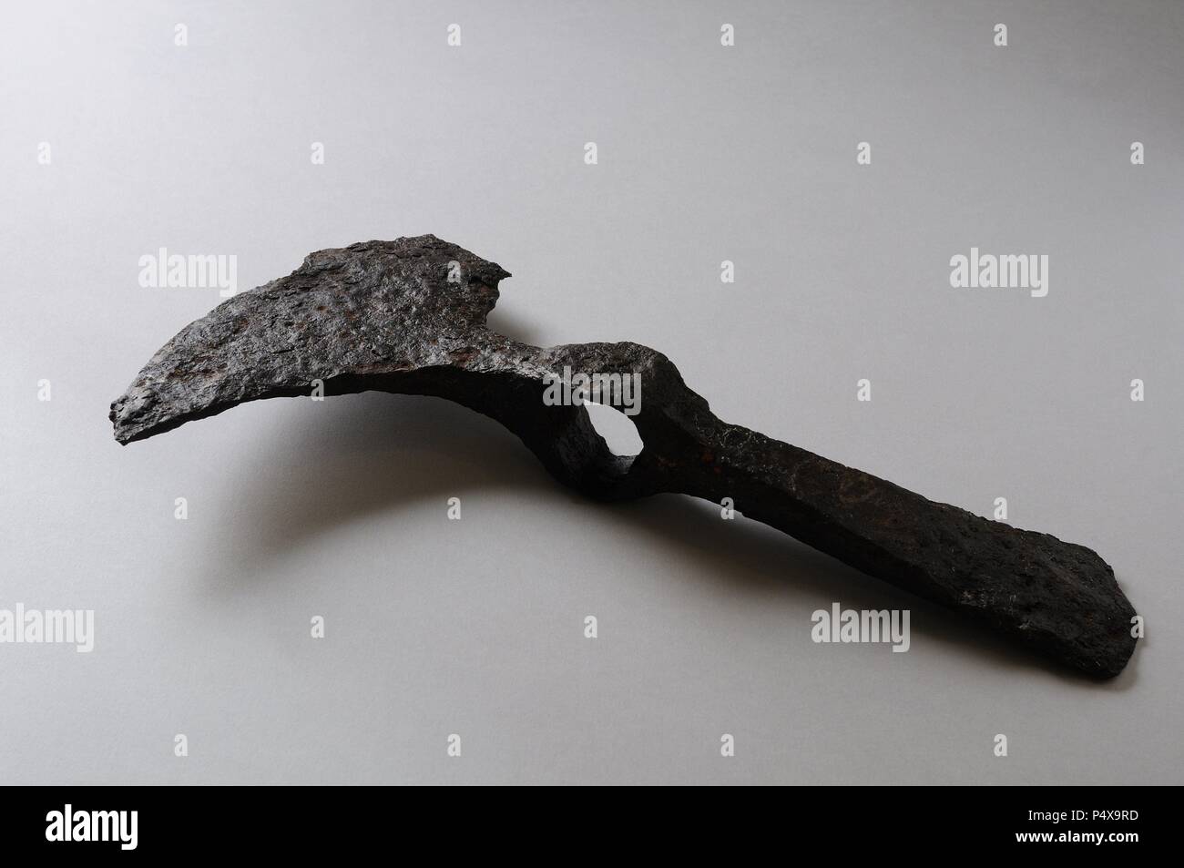 Axe iron adze. Length 31 cm Width 17 cm Weight 960, 02 gr. ( 4 th - 8 th CE ) - Visigoth period from the archaeological site of the " La Gravera " in Alcala de Henares - " Burgo de Santiuste Museum" . (Madrid). SPAIN. Stock Photo