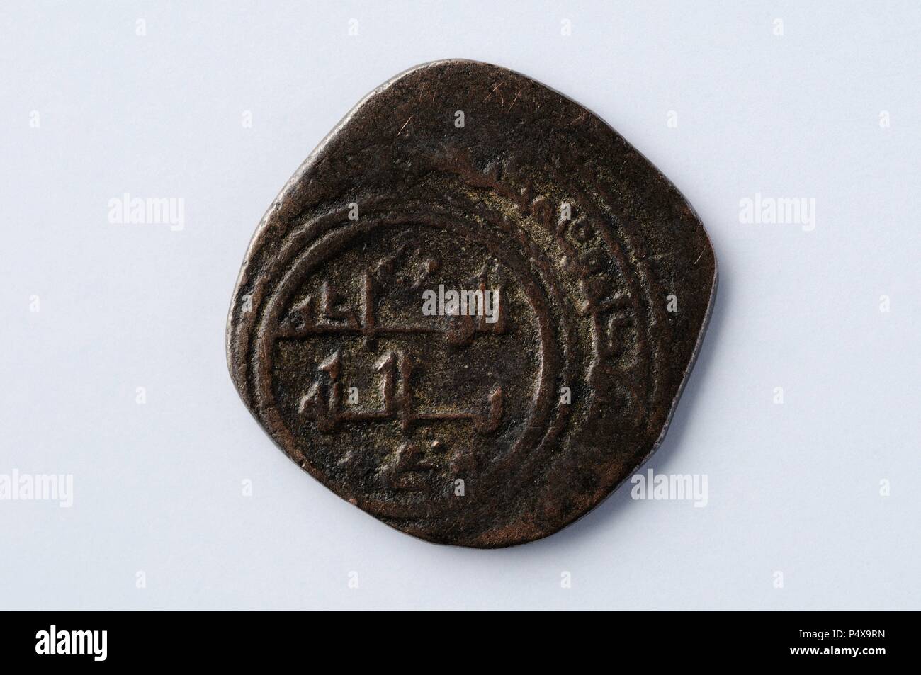 Dirhem copper al-Qadir Yahyat . Minted in Valencia. Diameter 22 mm Thickness 1 mm (1085 -1092) - Hispanic-Muslim period belonging of the ' Burgo de Santiuste Museum' in Alcalá de Henares. (Madrid). SPAIN. Stock Photo