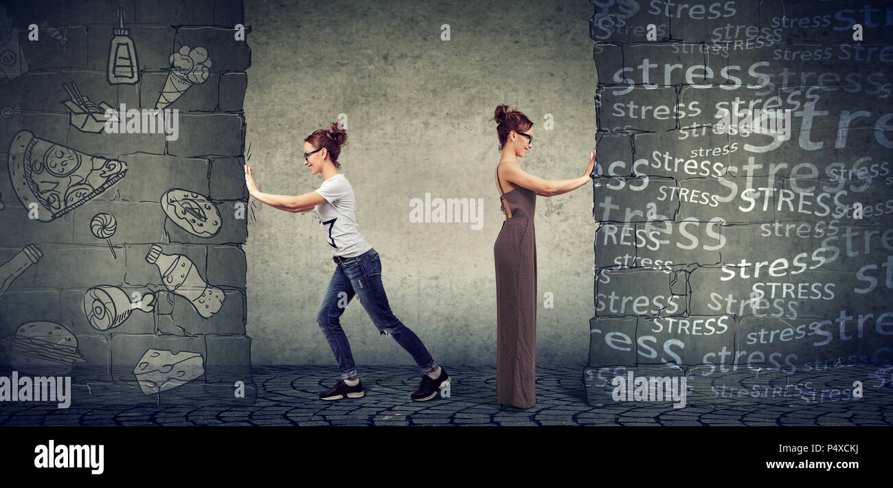 Motivated young woman resisting outside stress and temptation of eating fast food and choosing better diet and lifestyle Stock Photo