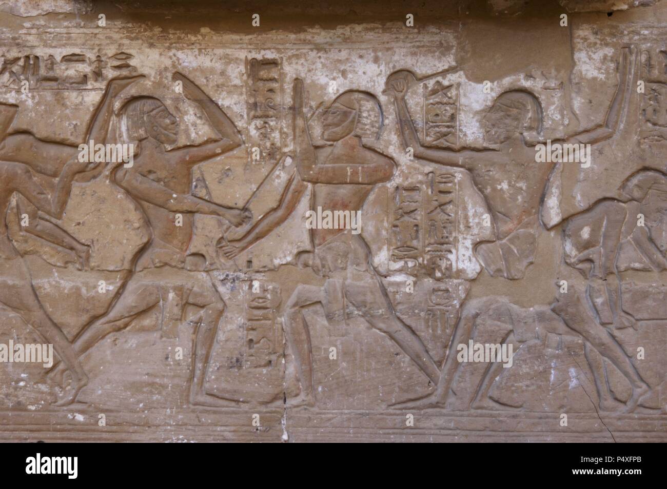 Temple of Ramses III. Relief depicting fencing fight with sticks. The fighters are wearing protective masks. New Kingdom. (1550-1069 b.C). Twentieth dynasty. Thebes. Medinet-Habou. Egypt. Stock Photo