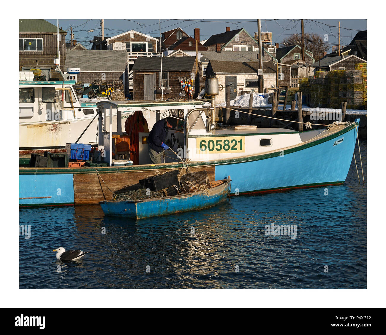 A working lobster boat in the harbor at Rockport, MA. Stock Photo