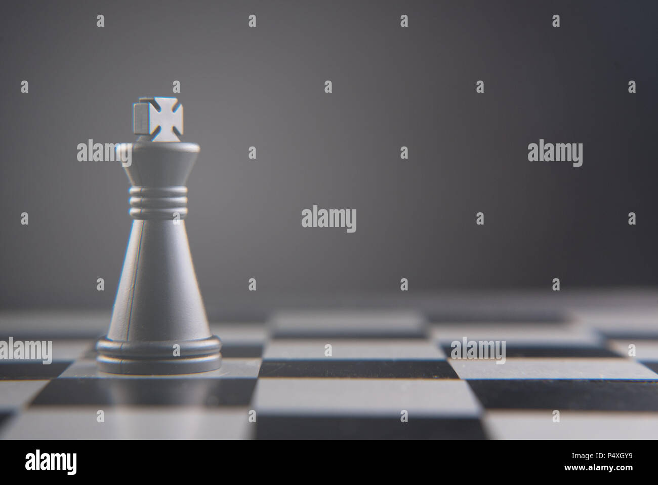 Chess pieces on a chessboard - Focus on the King Stock Photo - Alamy