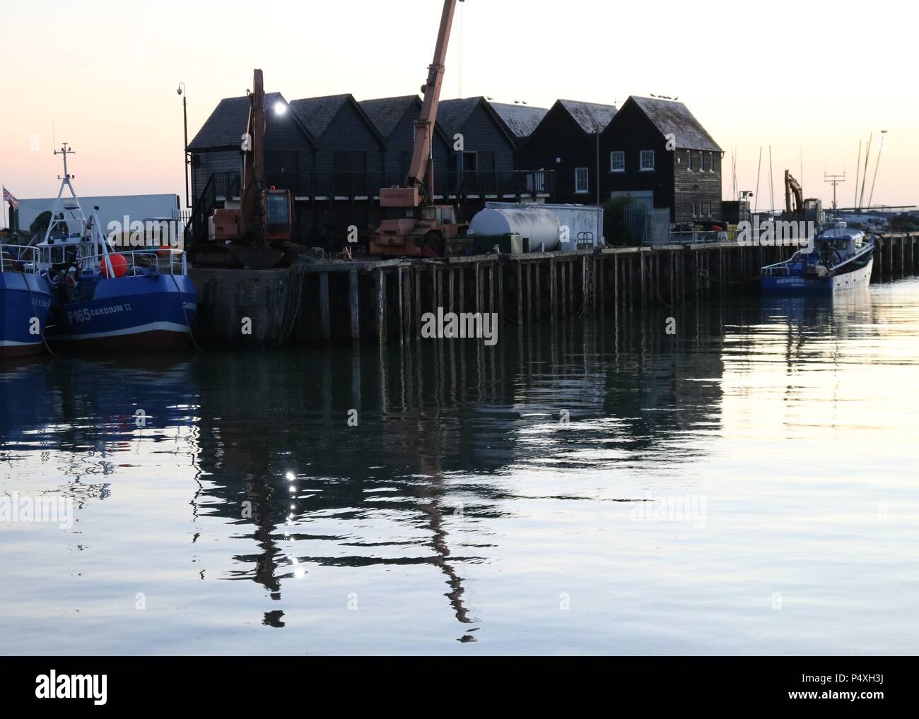 Busy industrial harbour , Whitstable Kent Stock Photo