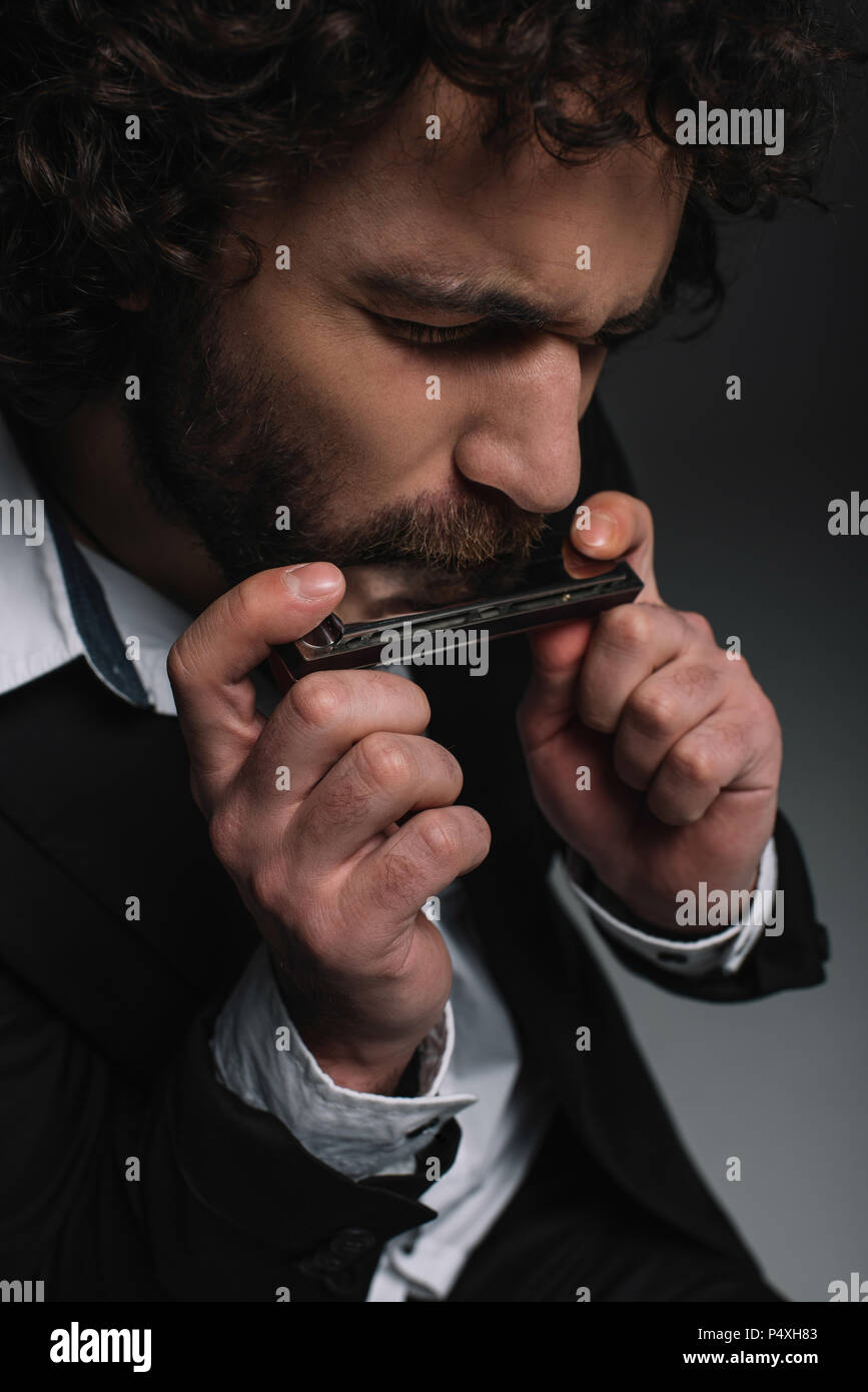 Man playing harmonica hires stock photography and images Alamy