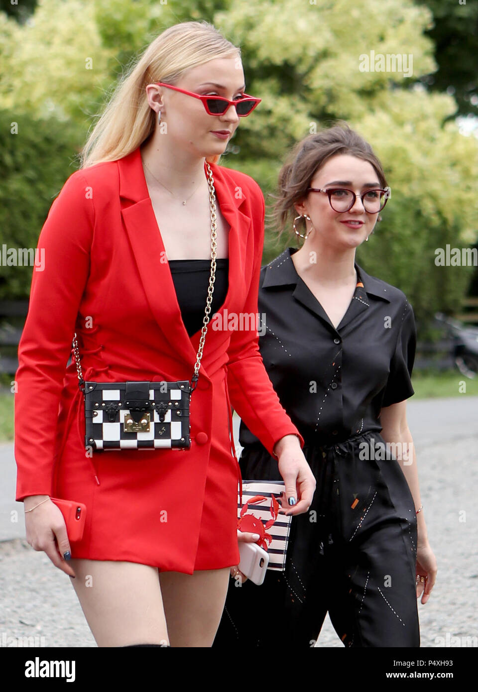 Actresses Sophie Turner (left) and Williams arrive at Rayne Church, Kirkton of Rayne in Aberdeenshire, for the ceremony of their Game Of Thrones co-stars Kit Harington and Rose Leslie Stock