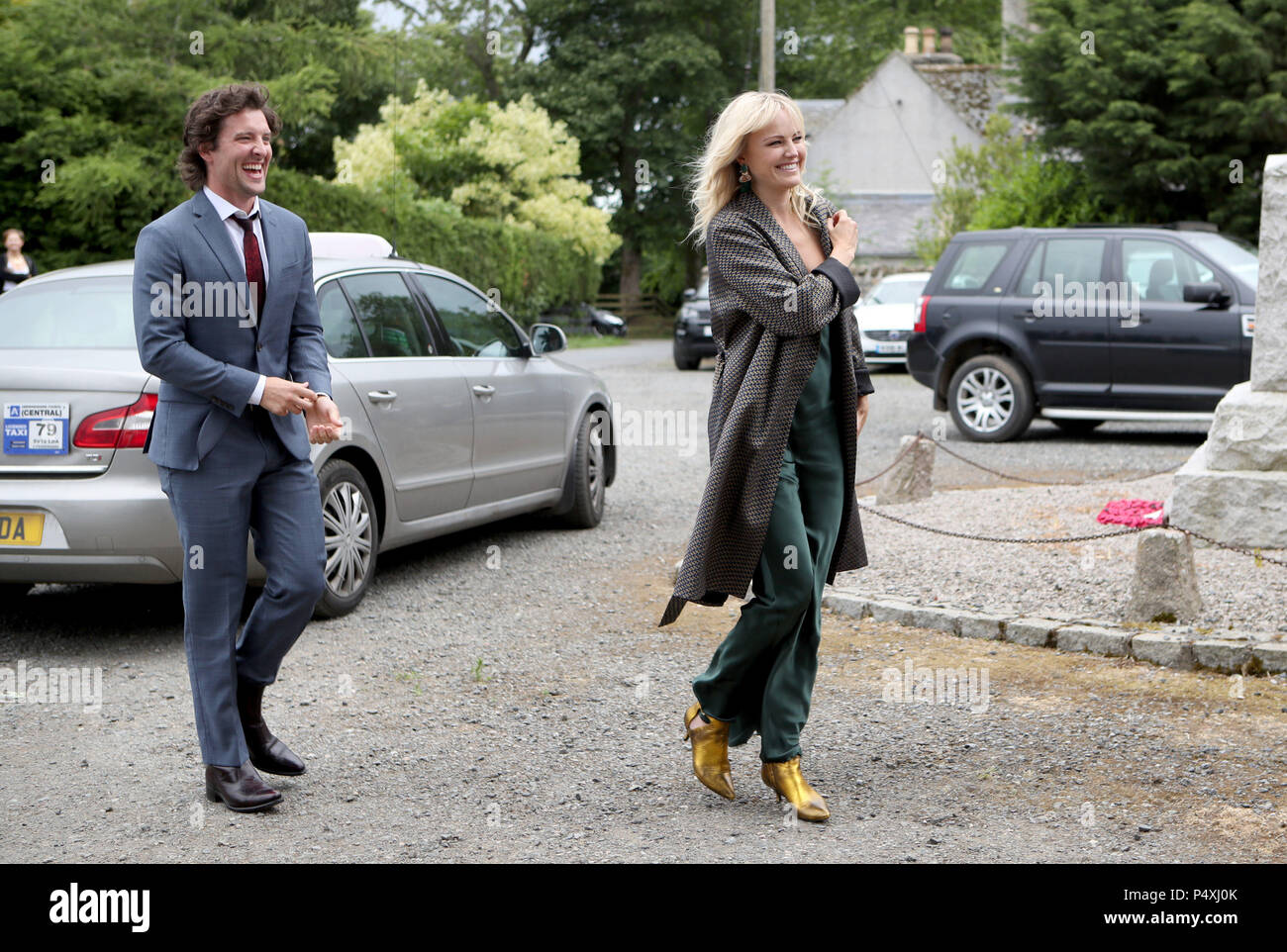 Actor Jack Donnelly arrives with partner Malin Akerman at Rayne Church, Kirkton of Rayne in Aberdeenshire, for the wedding ceremony of Game Of Thrones stars Kit Harington and Rose Leslie. Stock Photo
