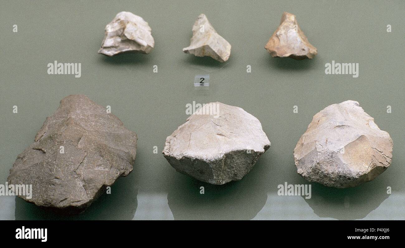 Prehistory. Middle Paleolithic or Mousterian (90,000 to 35,000 BC). Quartzite cleaver and  bifaces of Aranzaduya (Urbasa). Museum of Navarre. Pamplona. Spain. Stock Photo